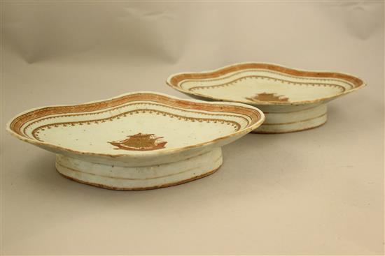 A pair of Chinese export enamelled porcelain lozenge shaped dishes, 19th century, made for the American market, 26.5cm